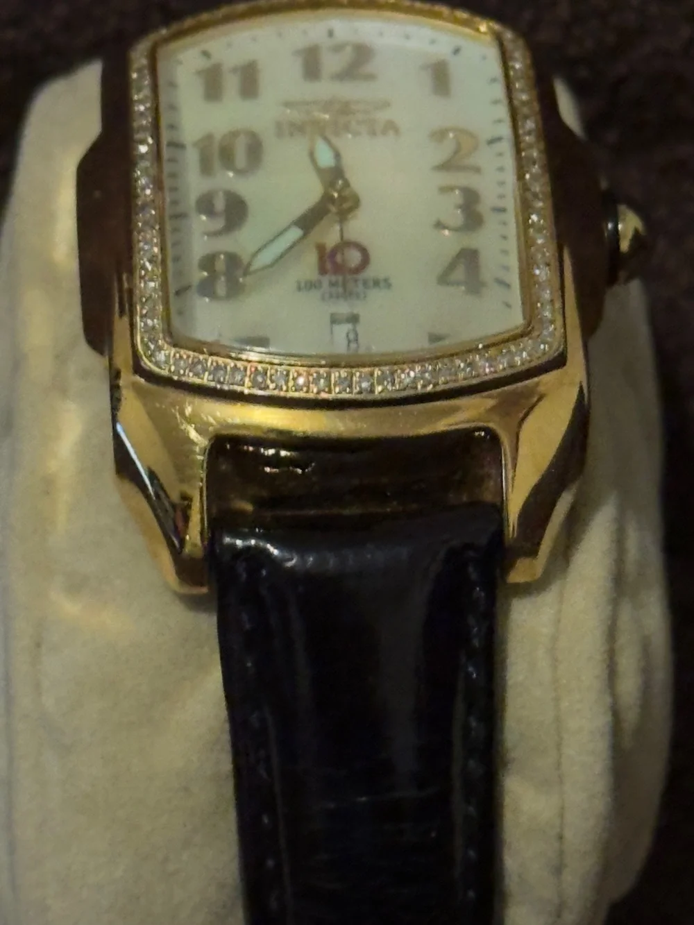 Invicta Women’s Gold-Tone Diamond Accent Watch with White Dial and Brown Strap.